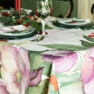Detail of the Helleborus tablecloth with pink flowers, green foliage and red berries
